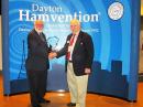 ARRL Past President Larry Price, W4RA (R), receives the Amateur of the Year Award from Hamvention General Chairman Charles Kaizer, KD8JZR. [Becky Schoenfeld, W1BXY, photo]